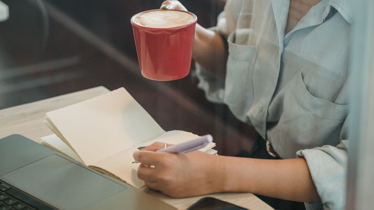 woman studying on smartphone during work break
