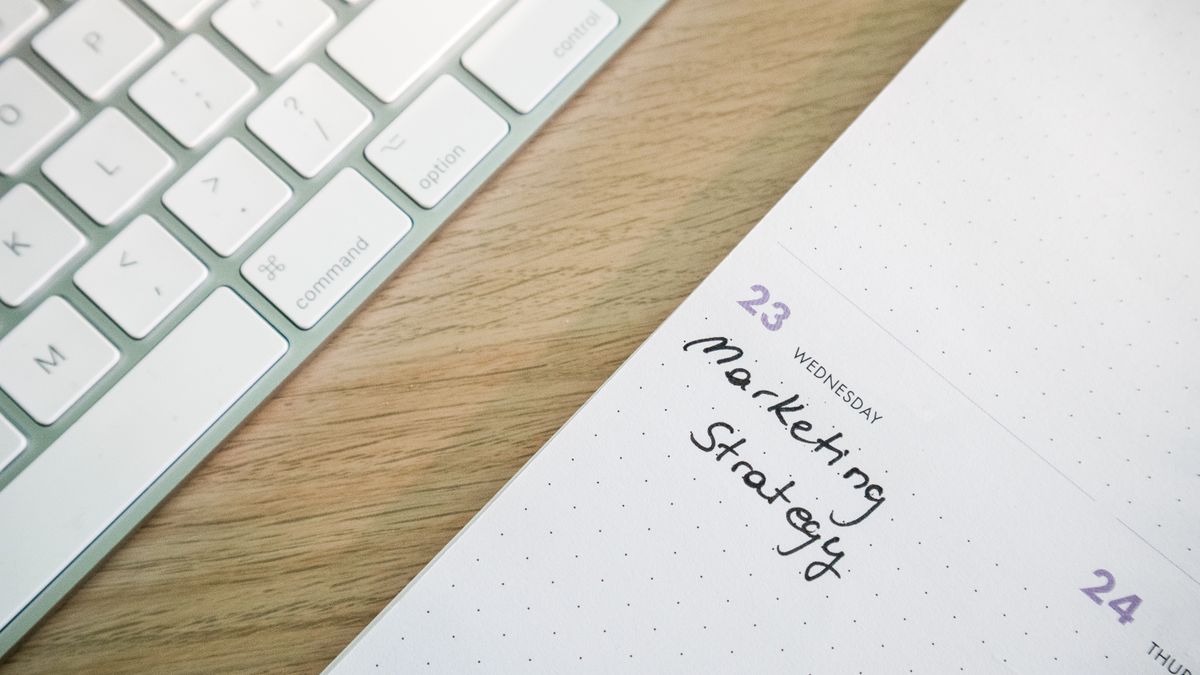 notebook with handwritten notes on desk