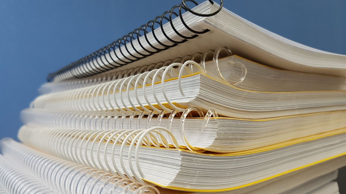 stack of textbooks on desk