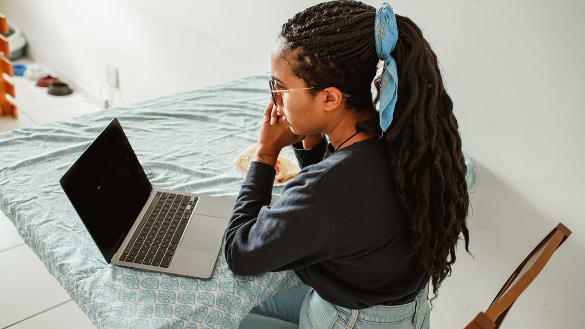 woman studying at home with laptop