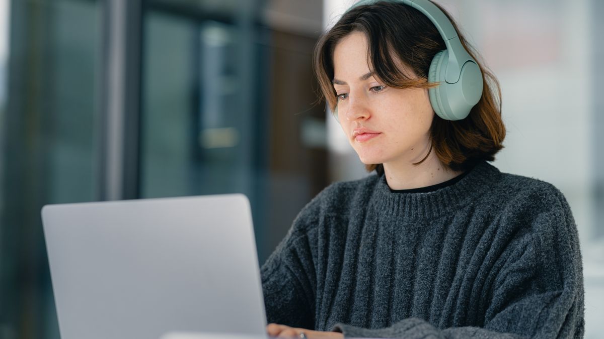office worker studying laptop night