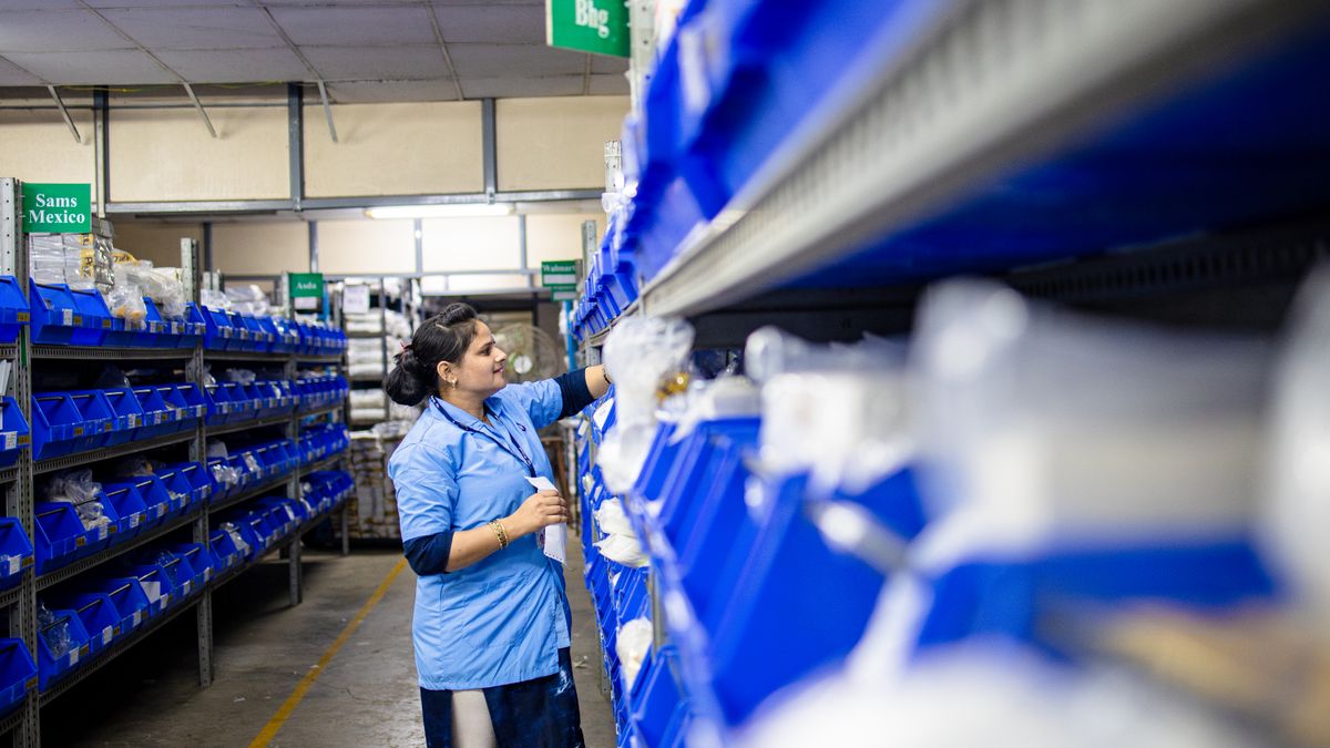 pharmacy staff organizing medicine shelves