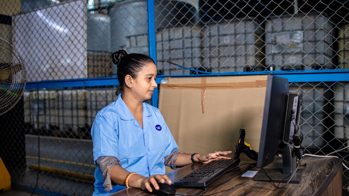 logistics office worker studying textbook at desk