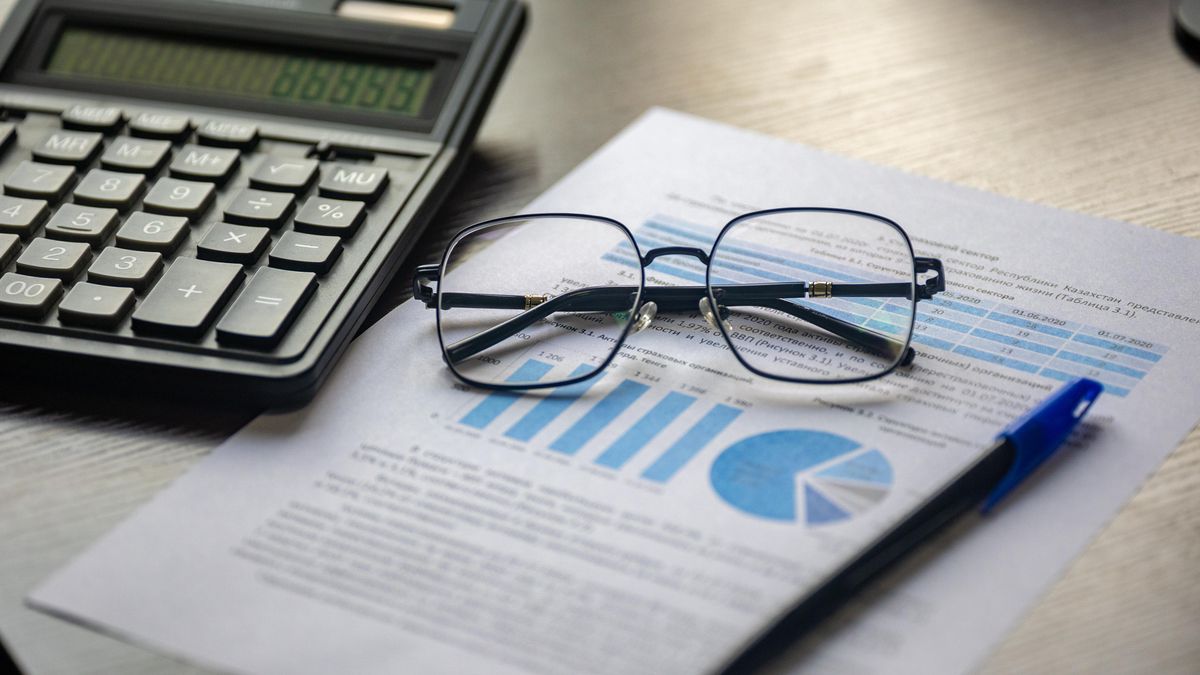 calculator with accounting documents on desk