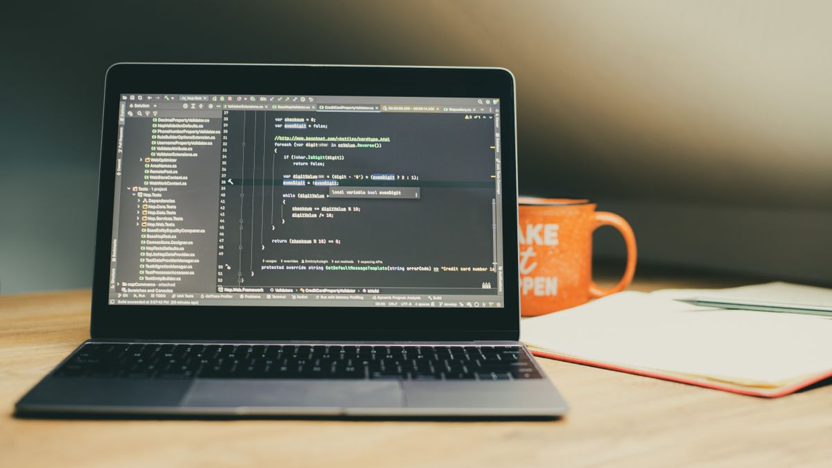 programmer reading code flowchart on notebook
