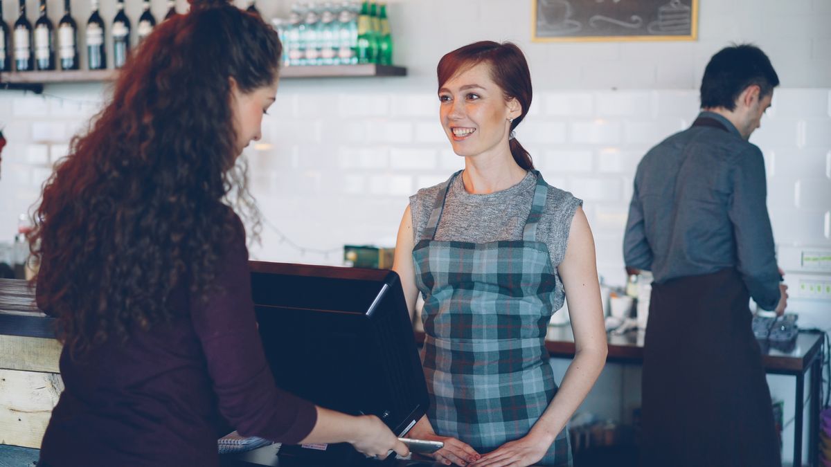 bank employee advising customer at counter
