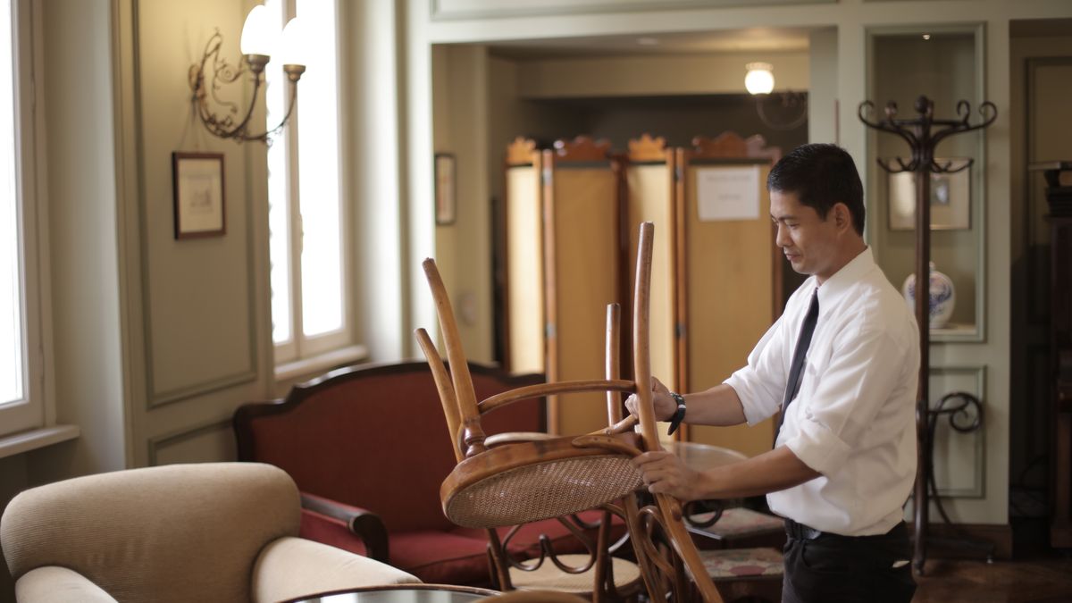cafe owner preparing small restaurant opening