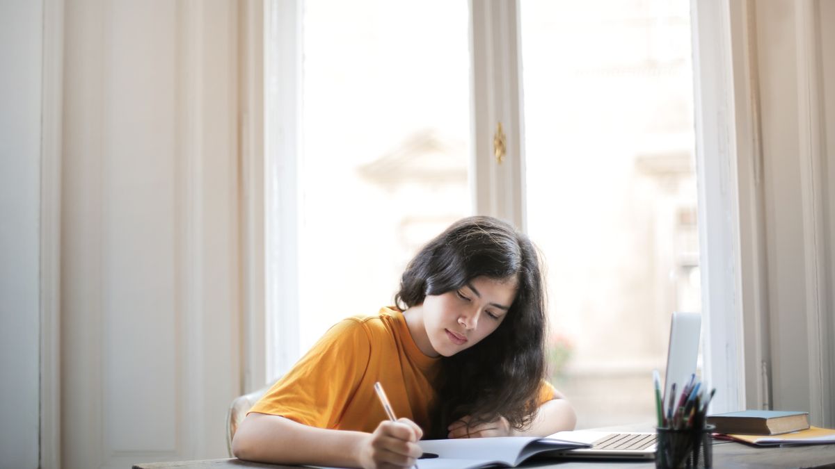 woman studying with notebook laptop