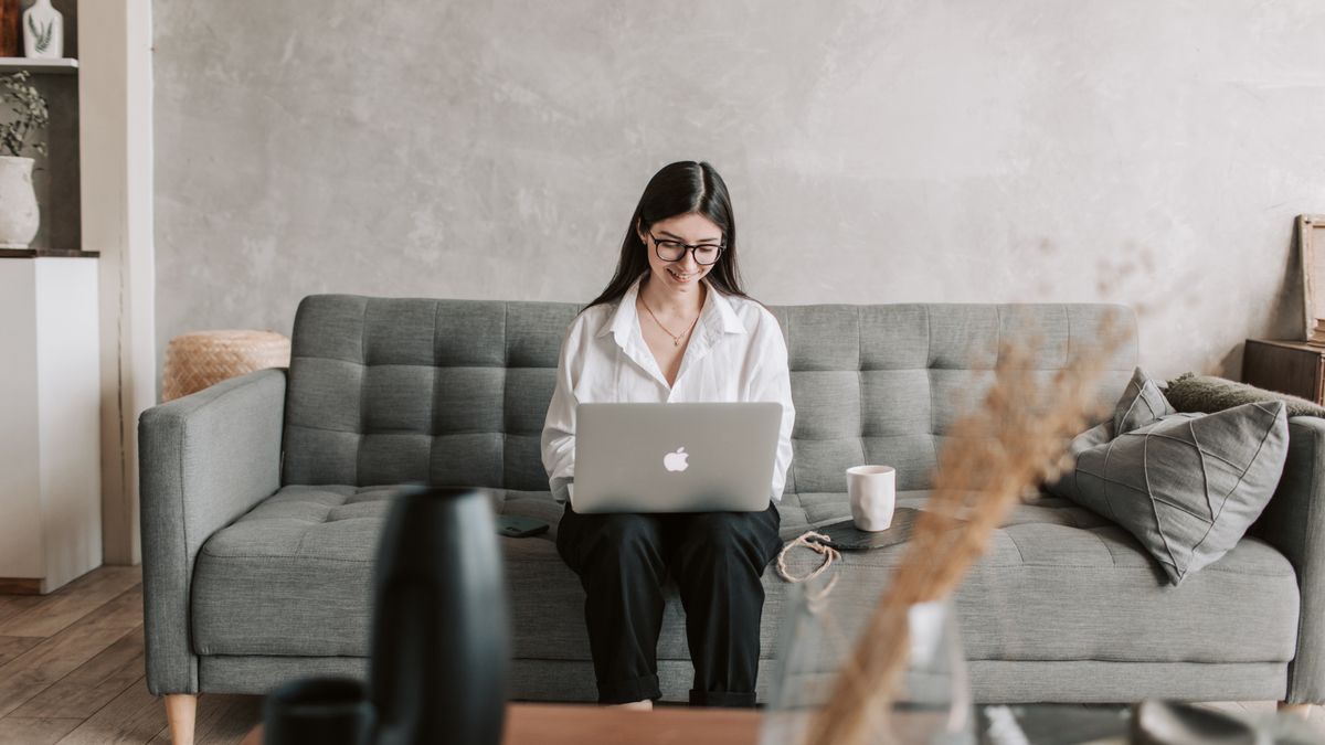 job seeker reading email on laptop at home