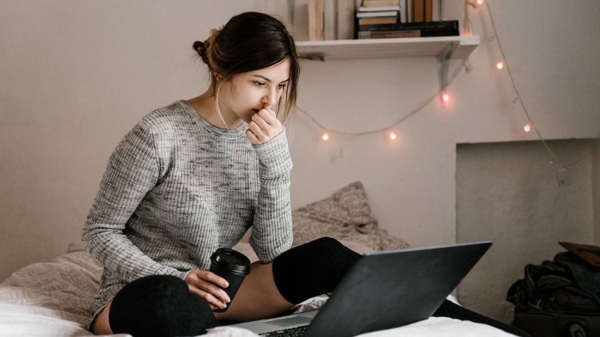 woman studying at home laptop