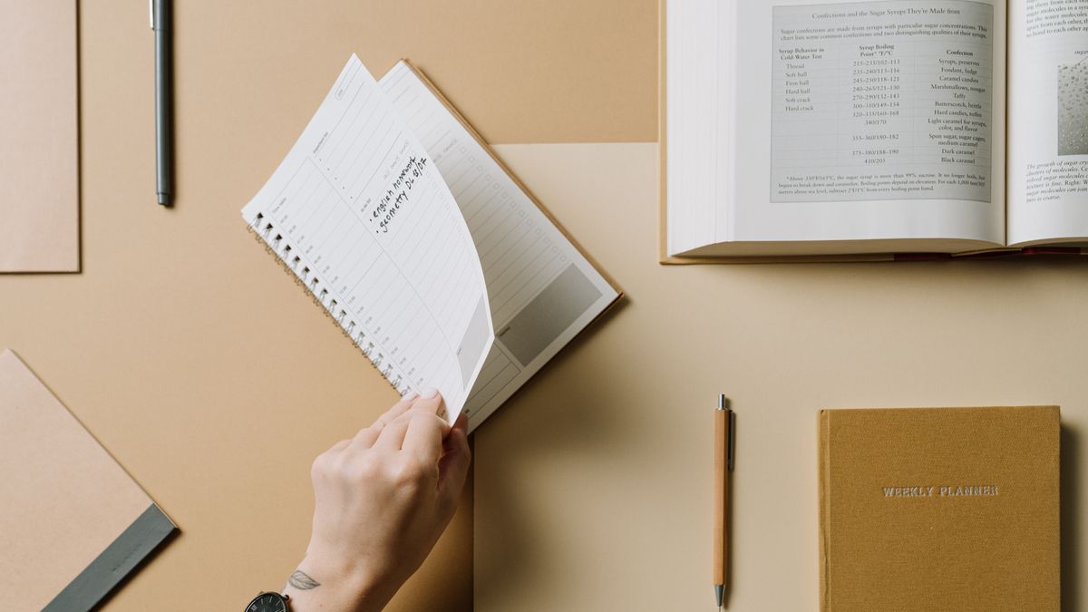 open notebook with study schedule calendar