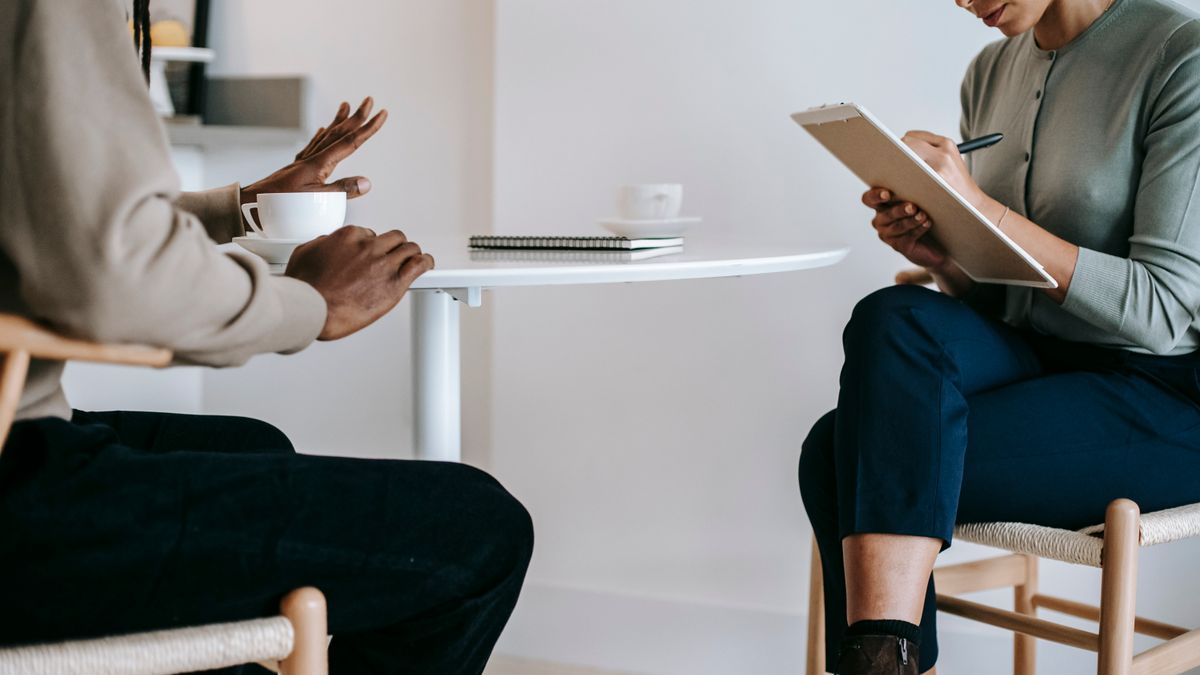 counselor talking with client in office