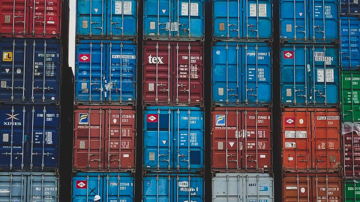 customs officer inspecting cargo container at port