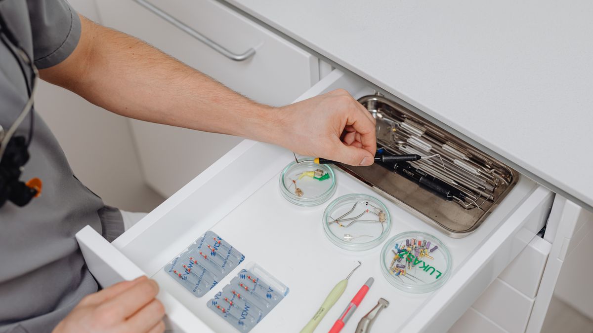 dental assistant preparing instruments