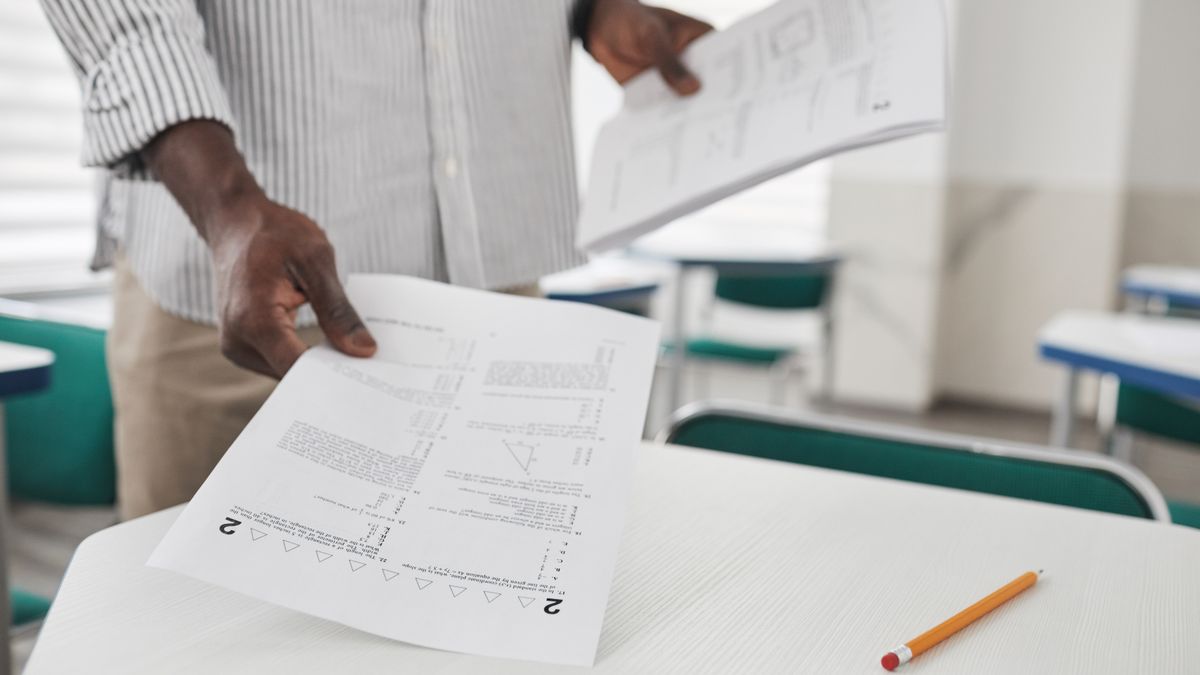 exam workbook on desk with pencil