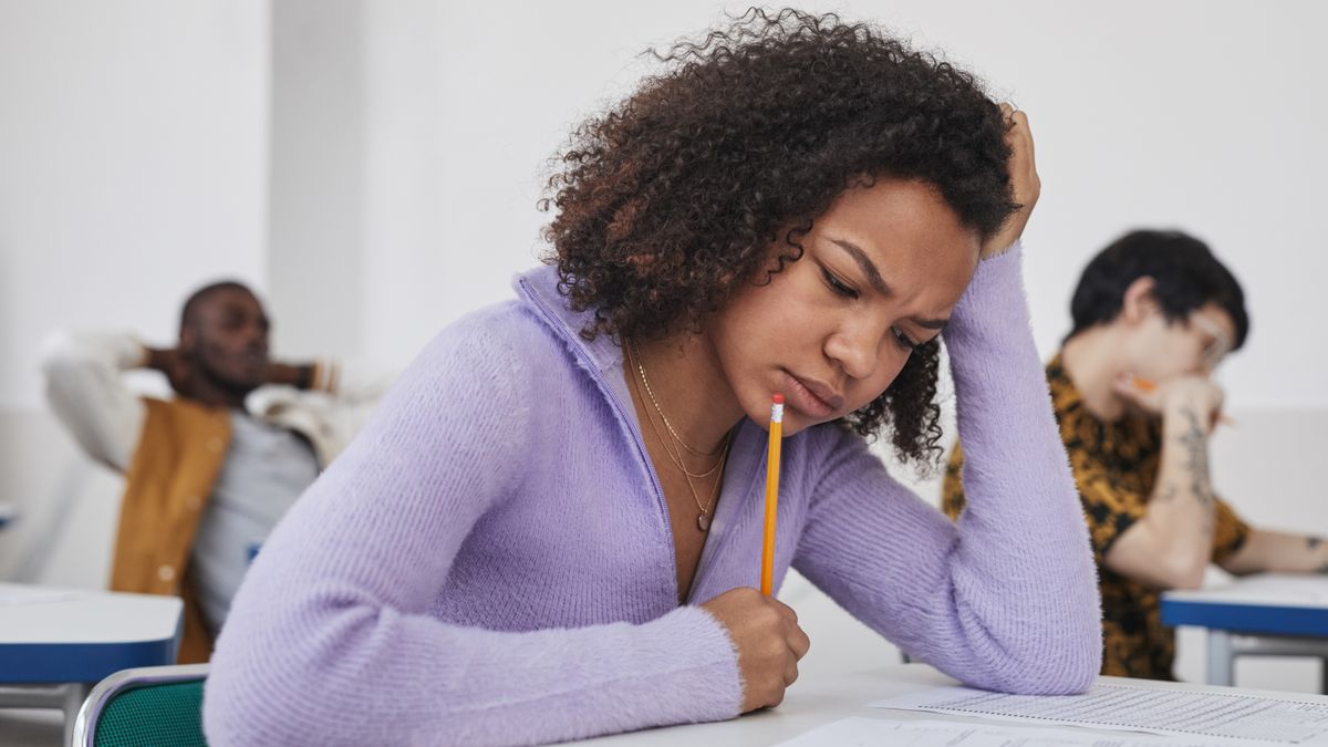 person solving practice test at desk
