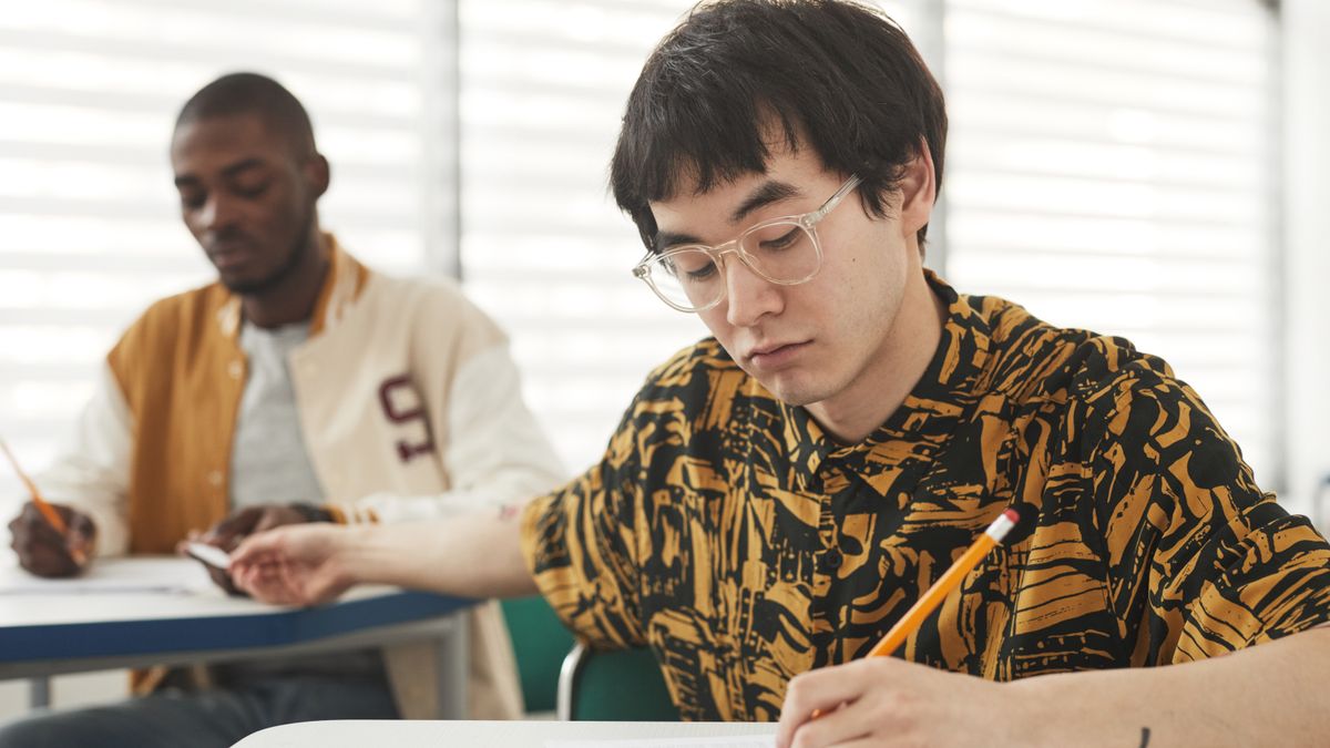 person taking computer based test at desk