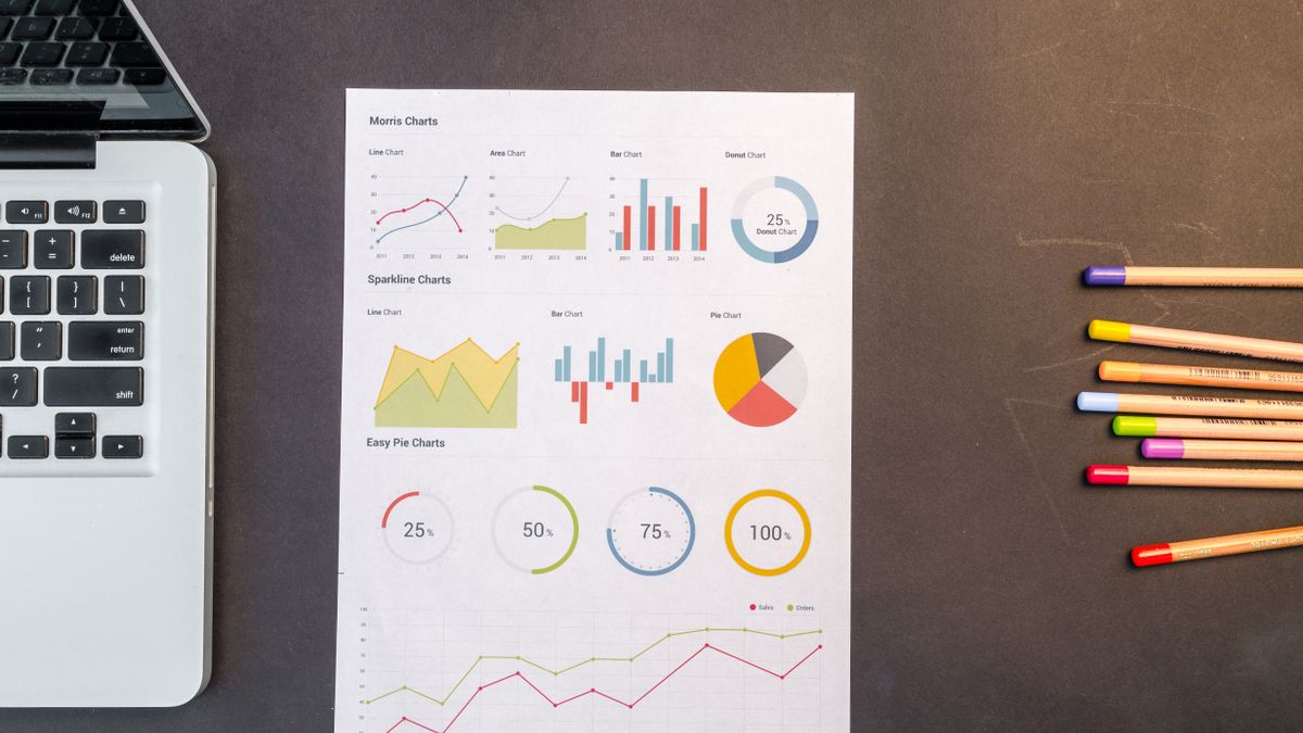 open textbook with colorful charts on desk