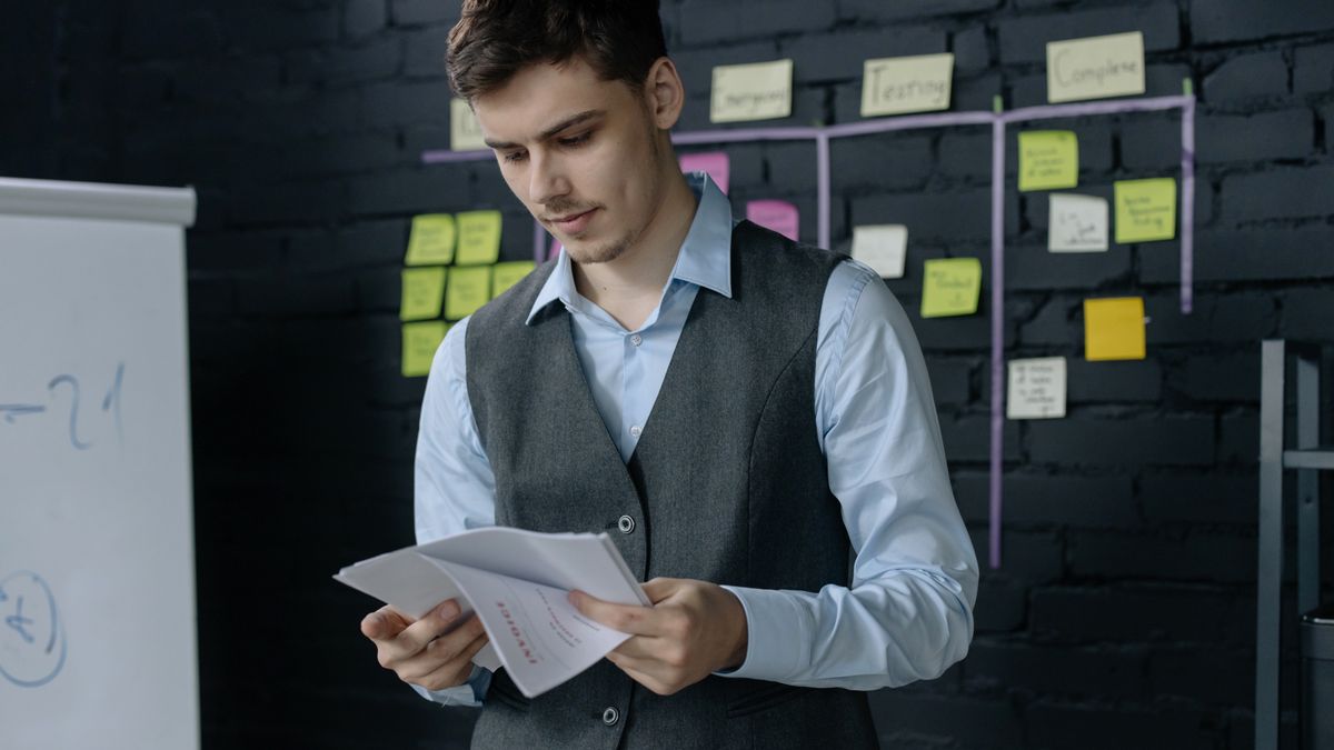 office worker reviewing payroll documents