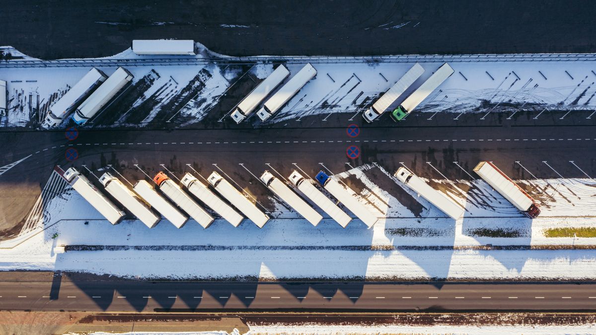 delivery truck driving on snowy road