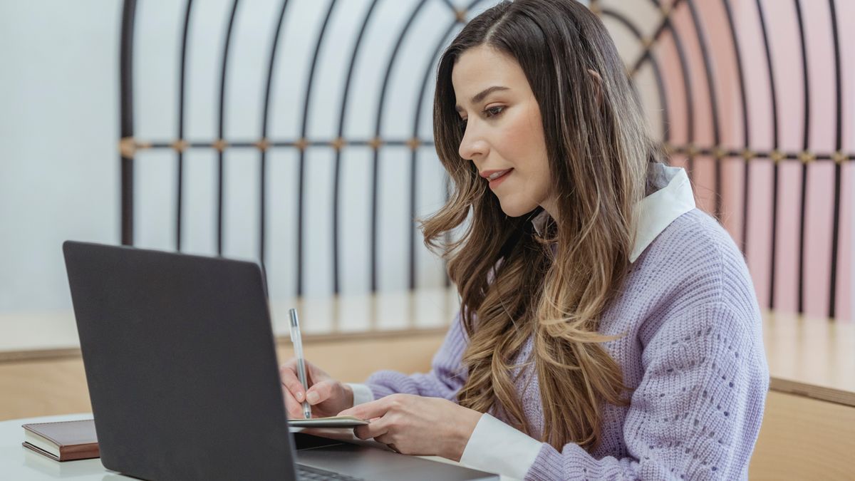 woman comparing online courses on laptop