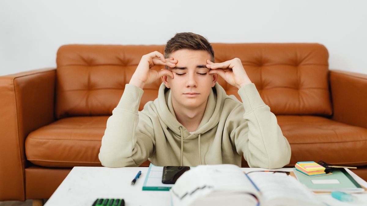 frustrated student studying at night