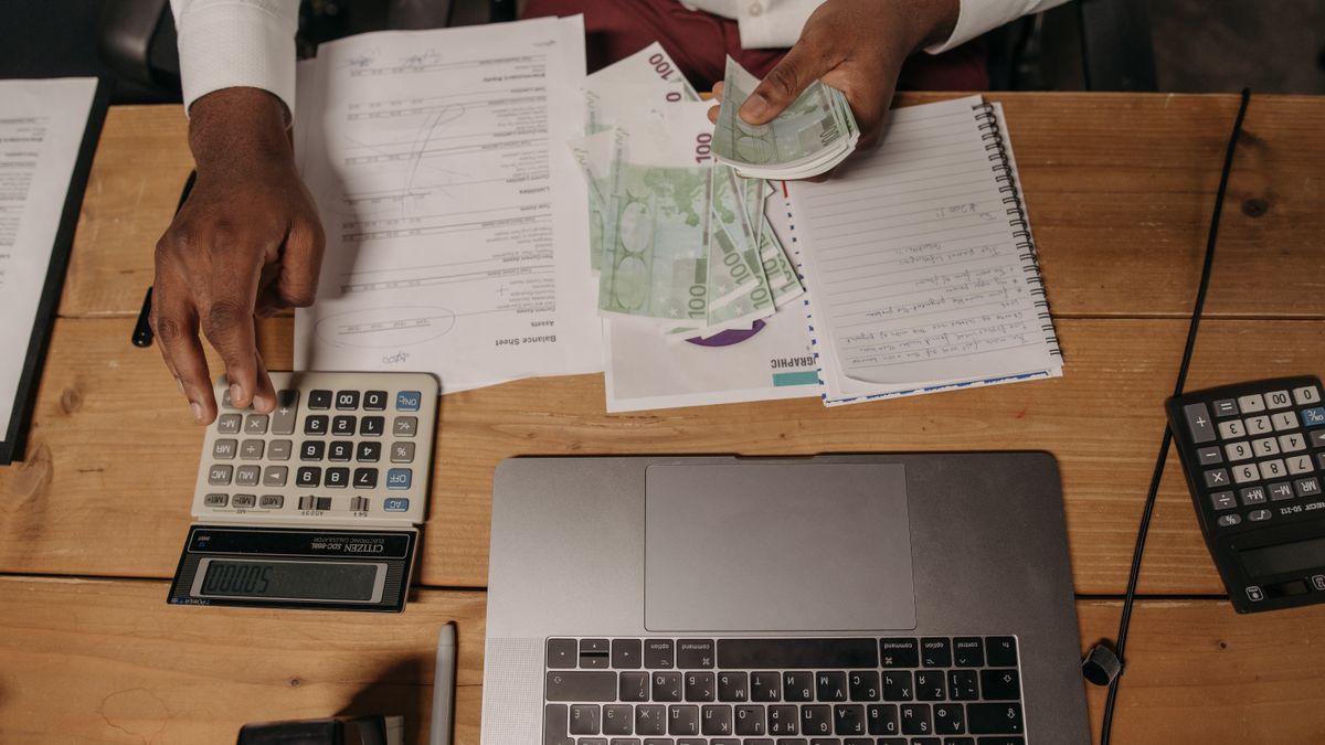 accounting textbook with calculator on desk