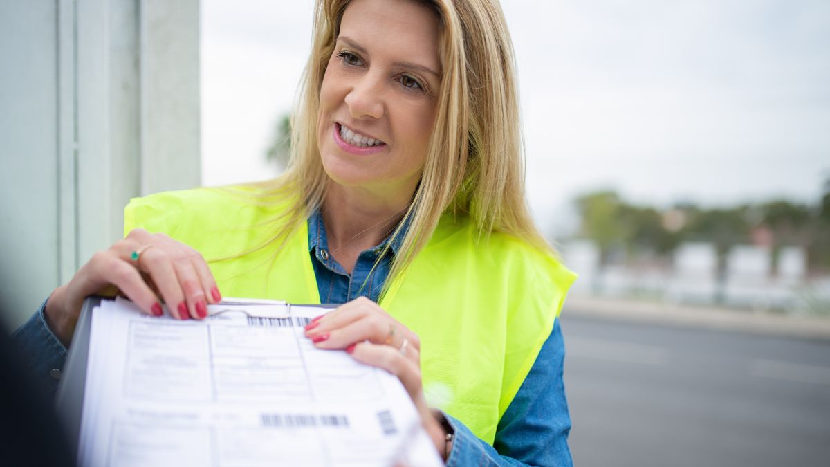 customs officer checking cargo documents at port