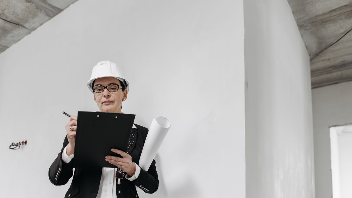 construction site manager checking blueprint