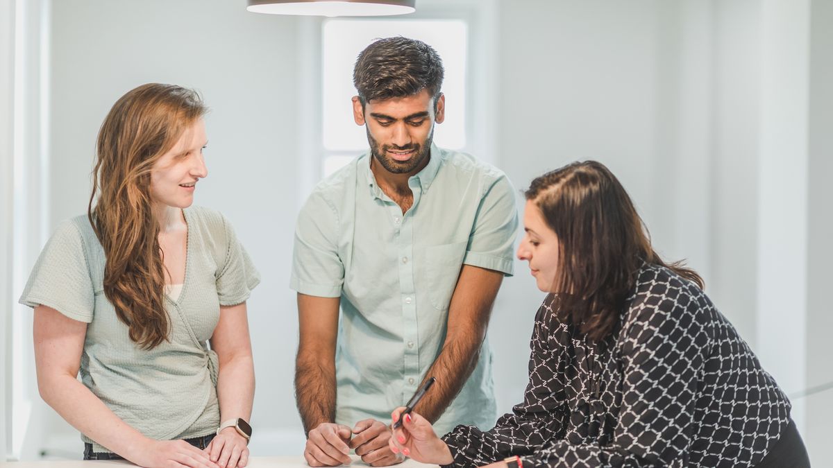 real estate agent explaining contract to couple