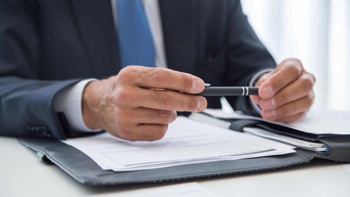 office worker reviewing contract documents