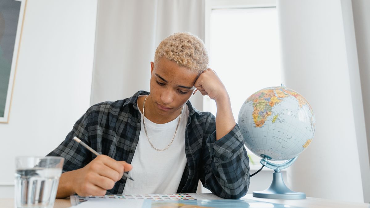 person studying weather map at desk