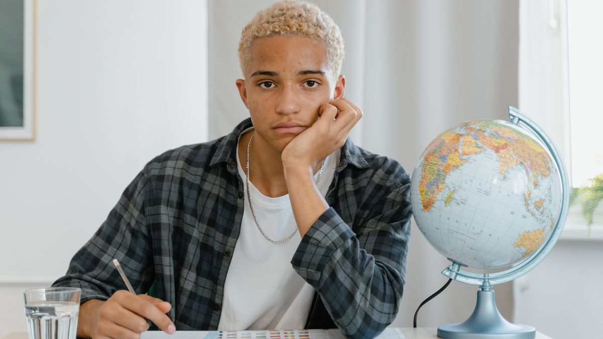 person studying weather map at desk