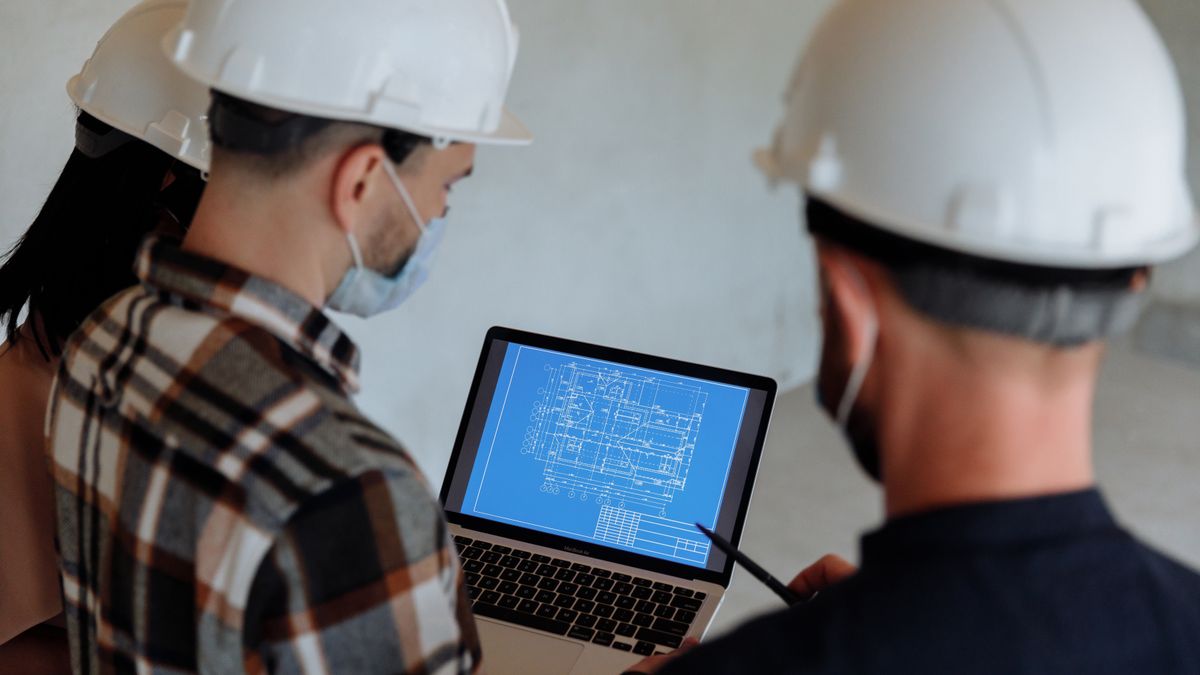 construction site manager checking blueprint