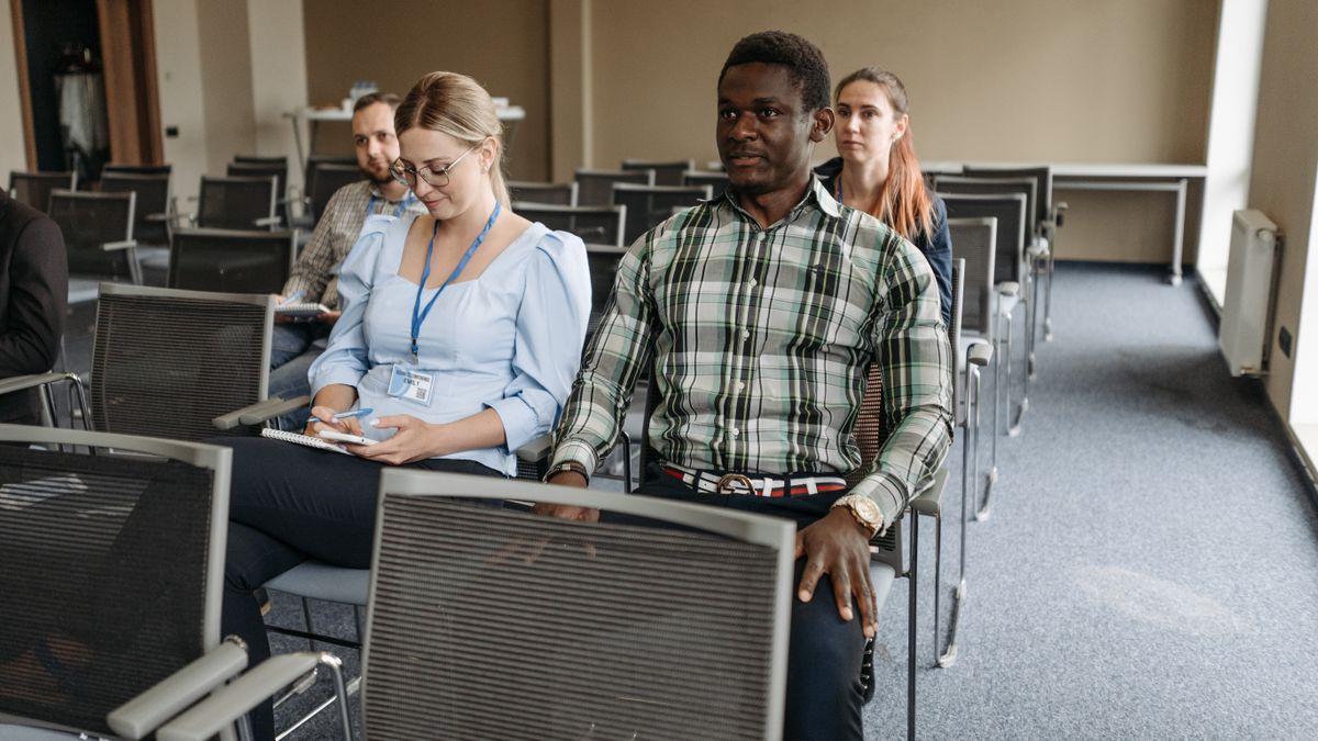 adults attending training seminar classroom