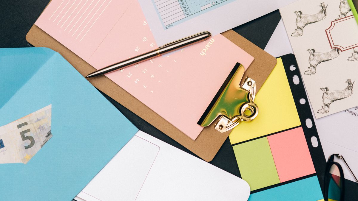 financial planner certificate documents on desk