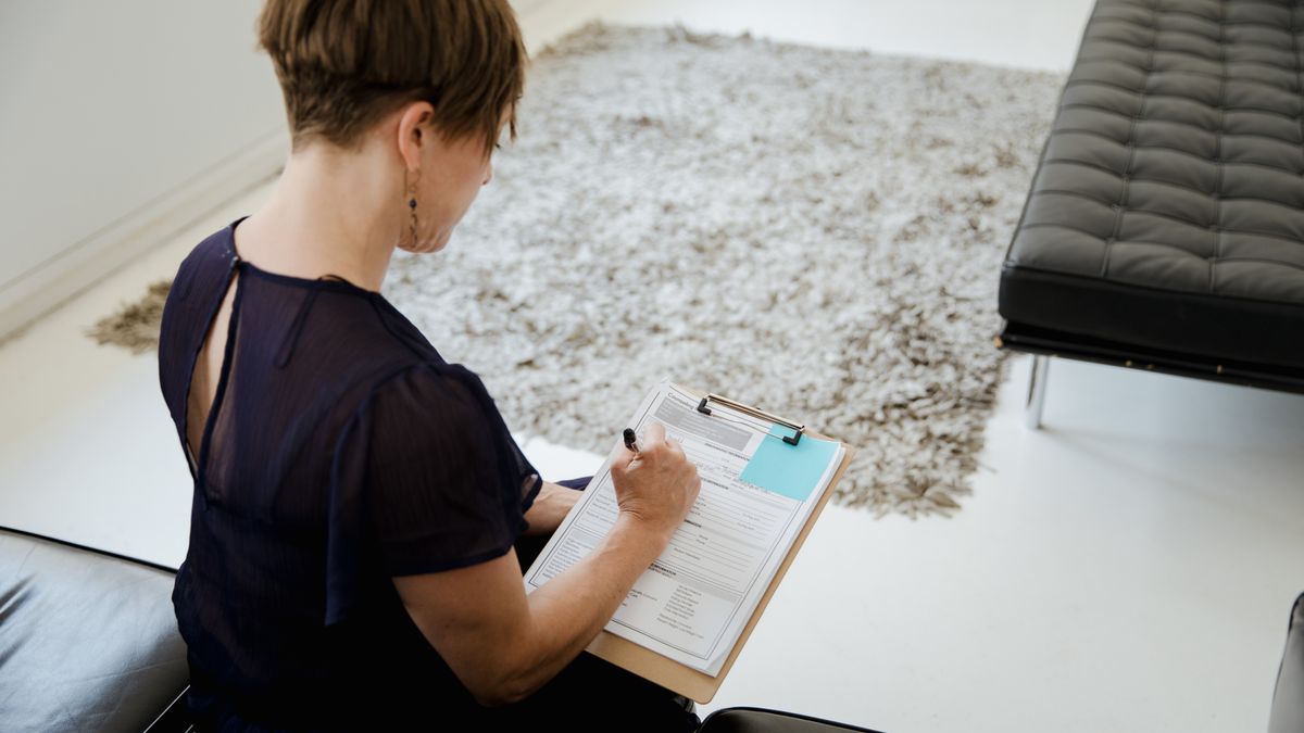 young professional filling out application form