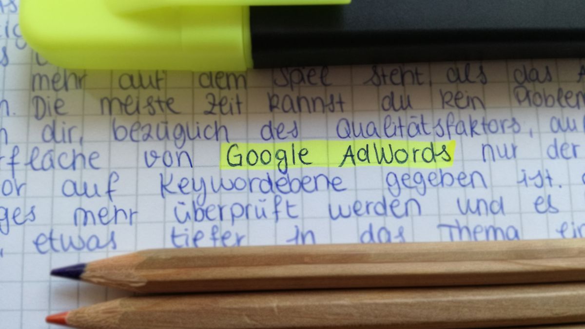 open notebook with handwritten notes, highlighter pen